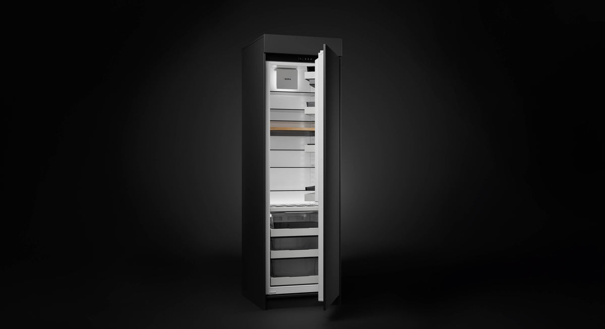 Réfrigérateur encastrable BORA Cool C178K, porte entrouverte sur un intérieur gris éclairé
