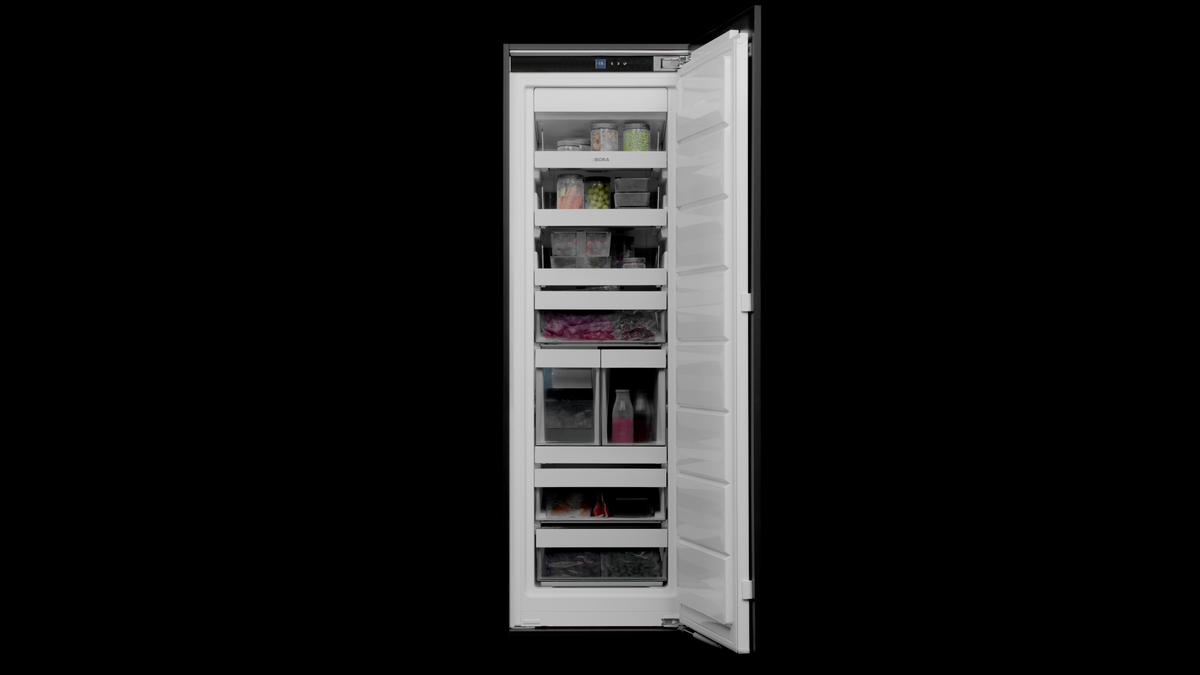 Intérieur du congélateur BORA Freeze ouvert, tiroirs transparents et aliments congelés