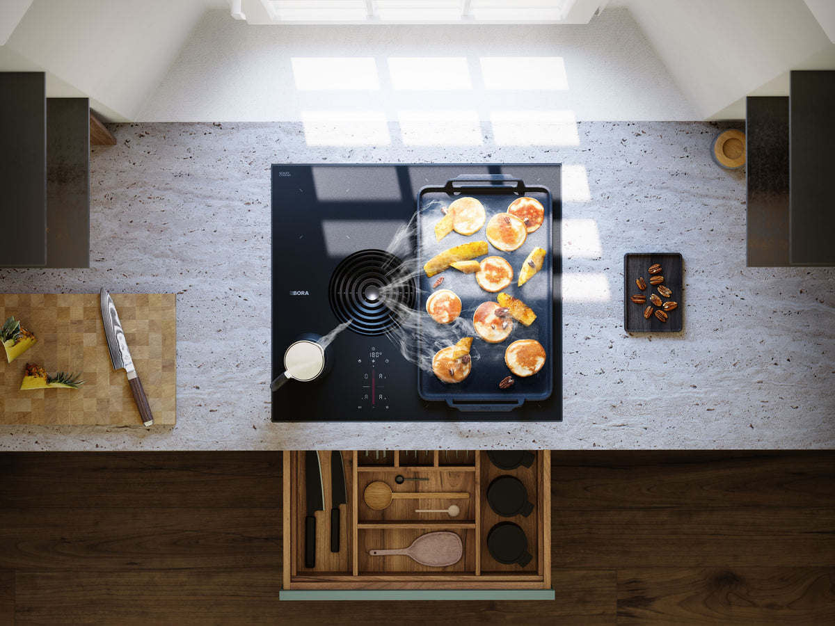 Cuisine vue de haut avec la table aspirante BORA S Pure encastrée dans le plan de travail