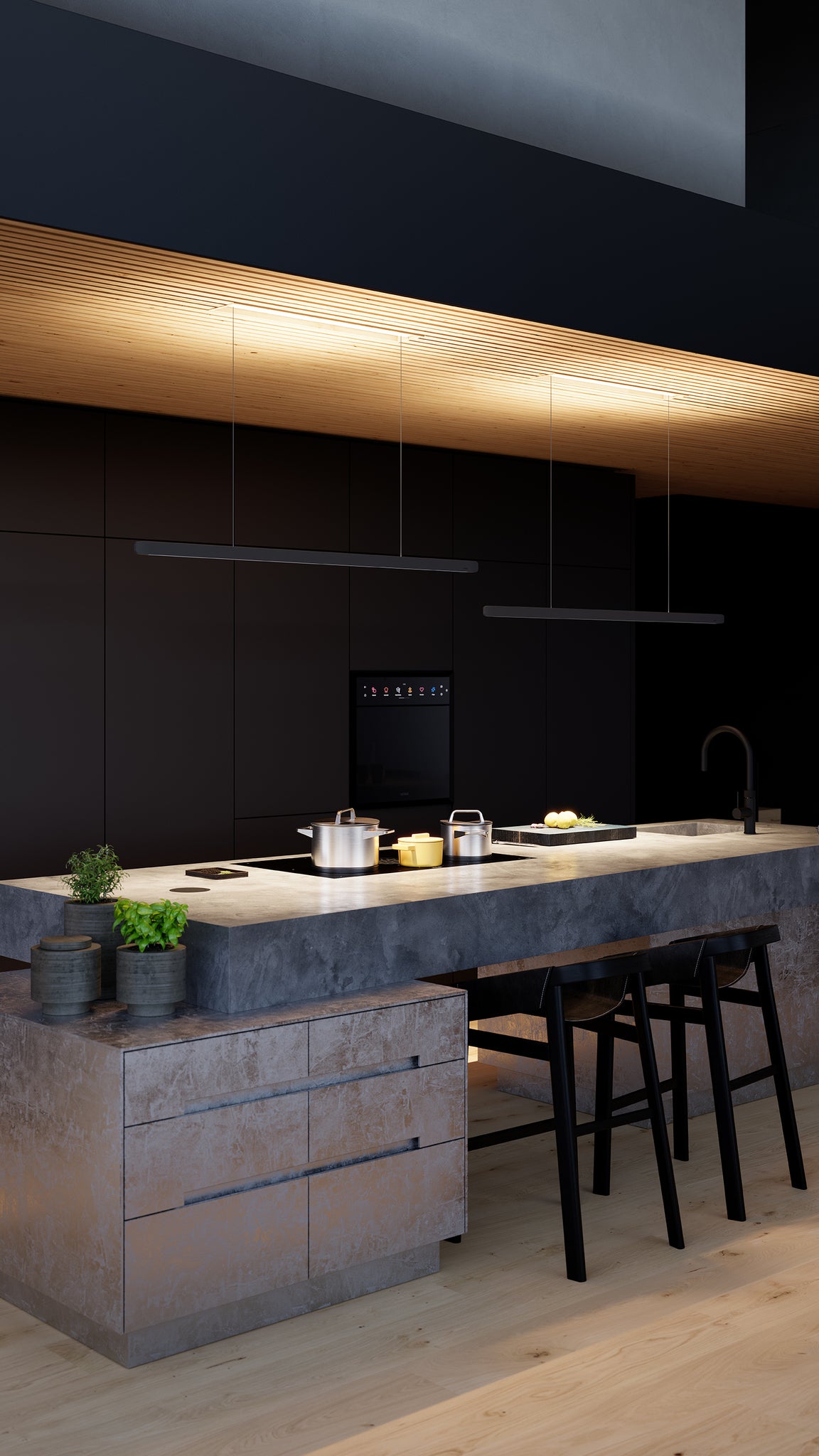 Cuisine moderne avec îlot minimaliste équipé d’une table de cuisson aspirante BORA, ambiance du soir