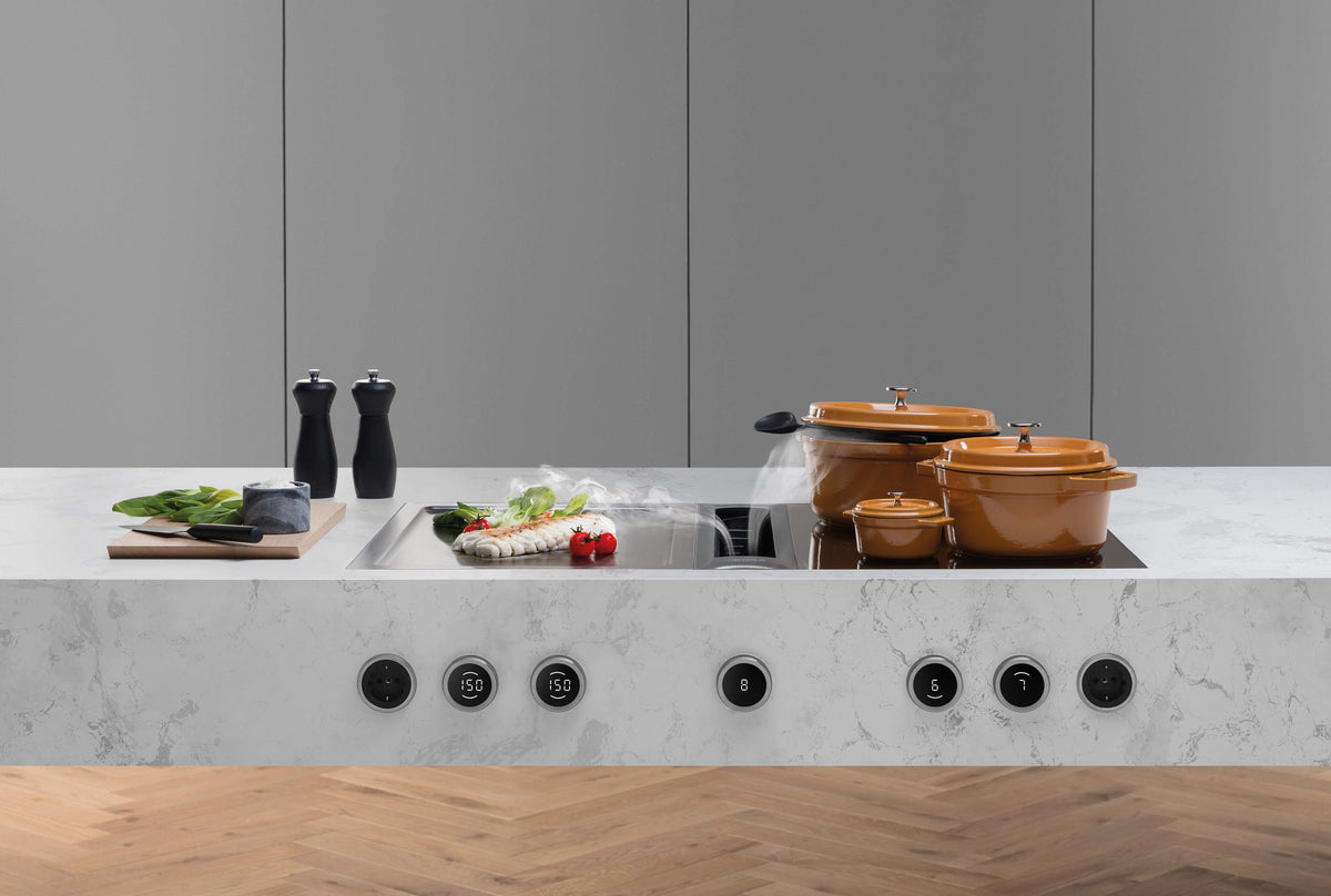 Cuisine avec îlot en marbre équipé du BORA Professional 3.0 et de ses boutons de commande